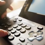 employee-dialing-a-phone